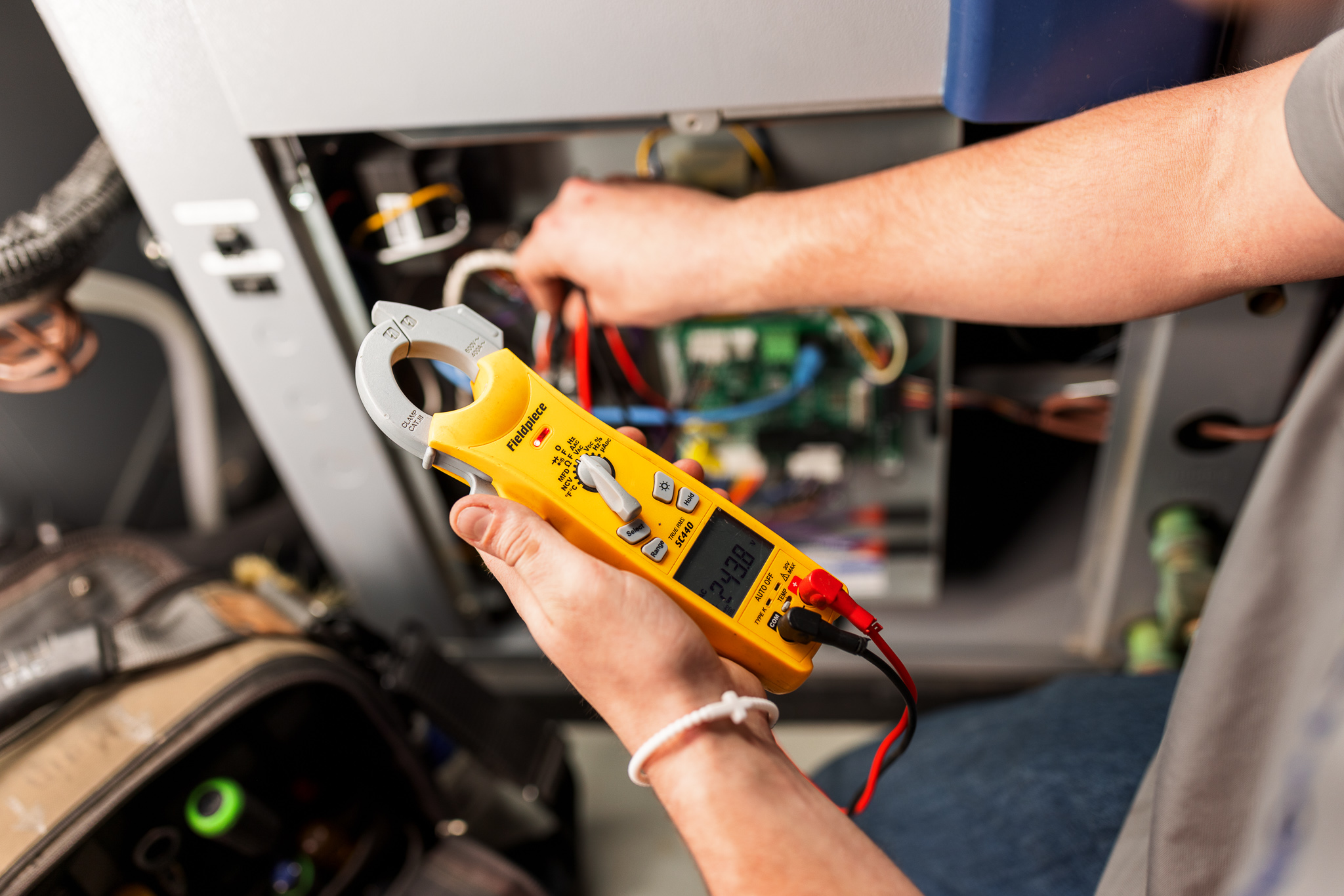 Technician checking voltage