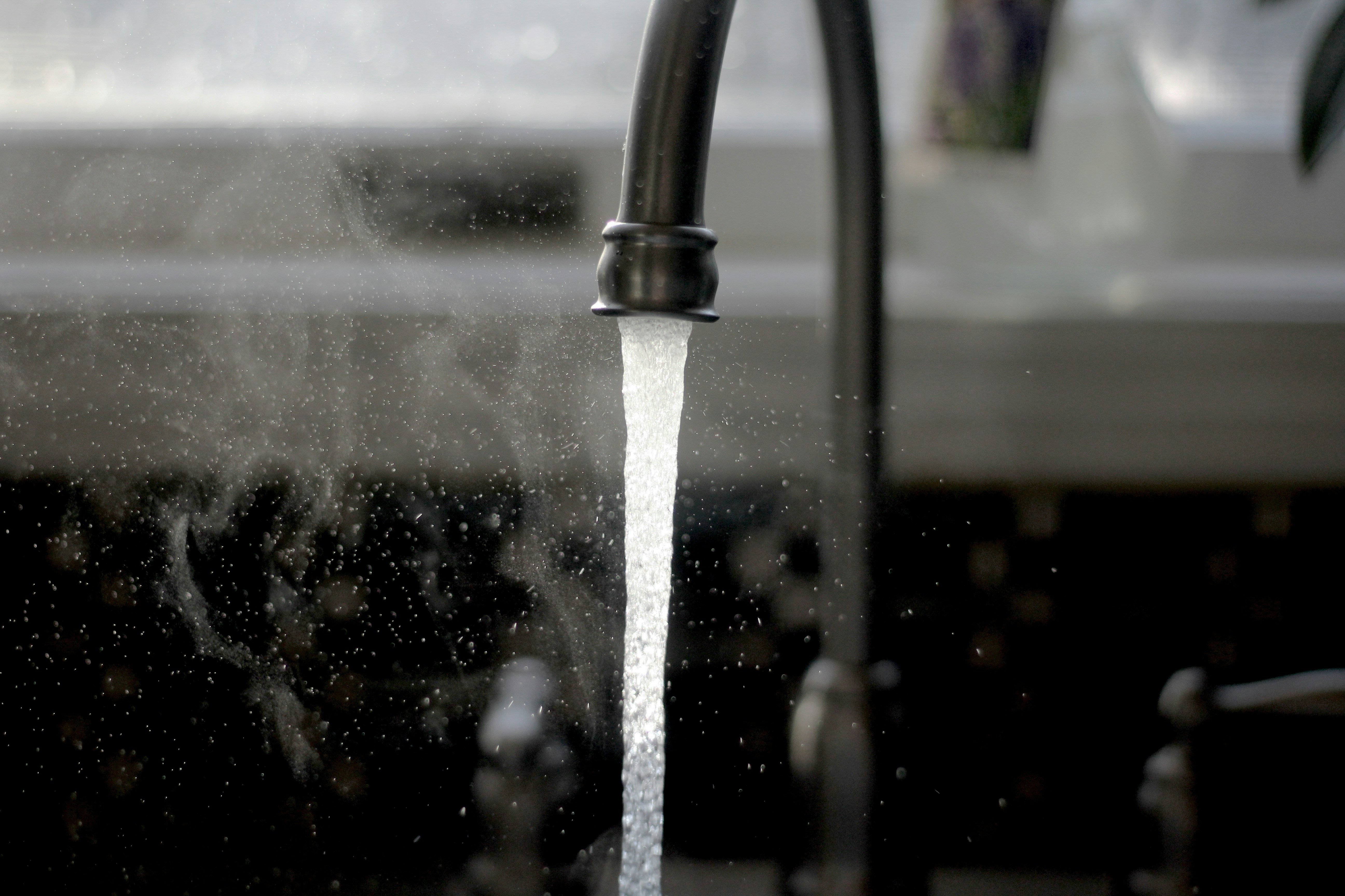 warm water coming out of faucet