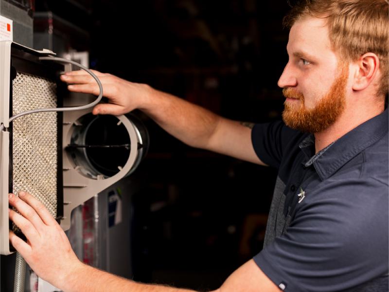 Technician checking filter