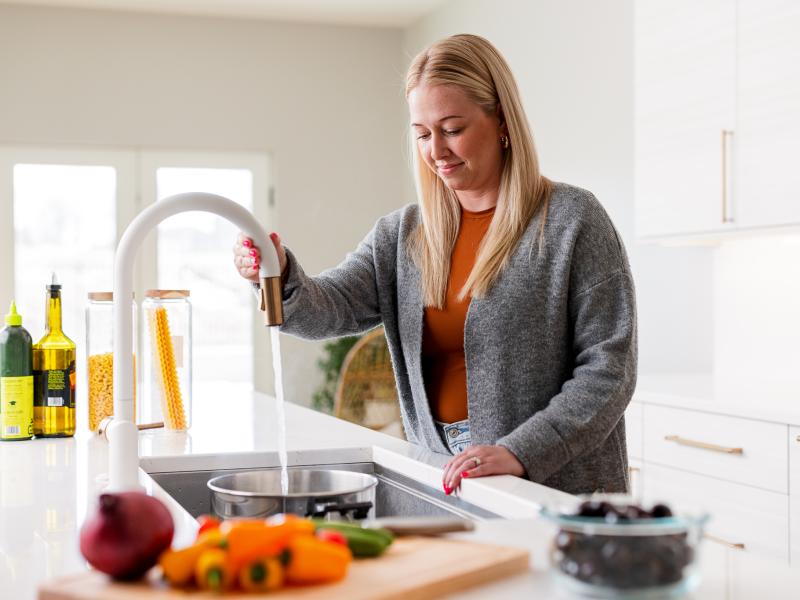 Woman Using Sink